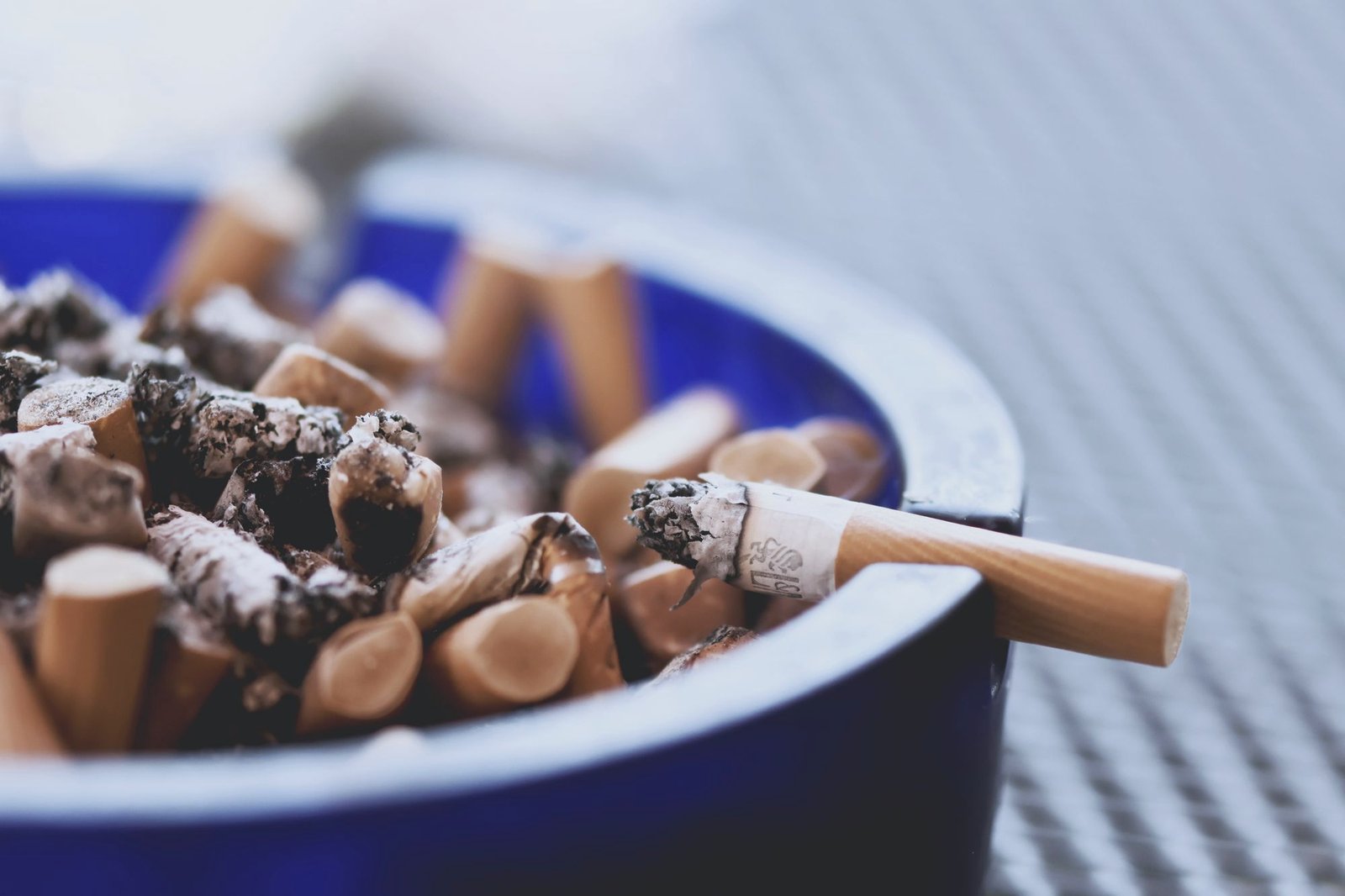 An ashtray full of cigarette ends