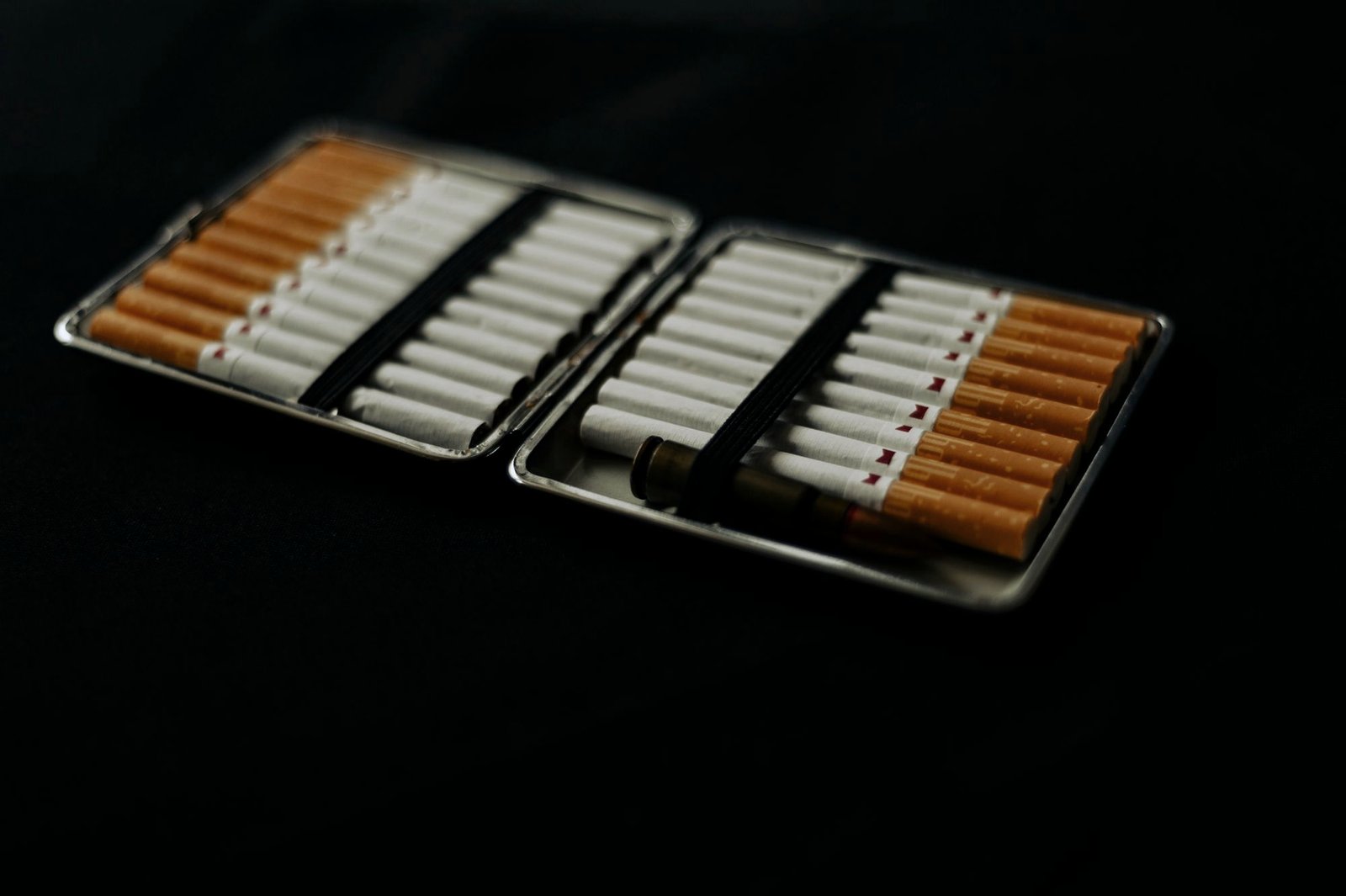 An open cigarette case full of cigarettes